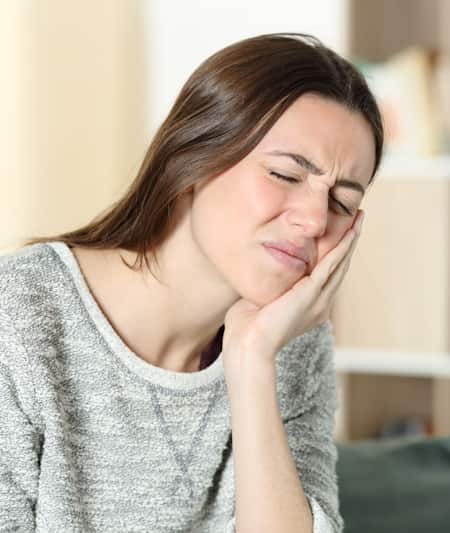Woman suffering with tmj pain
